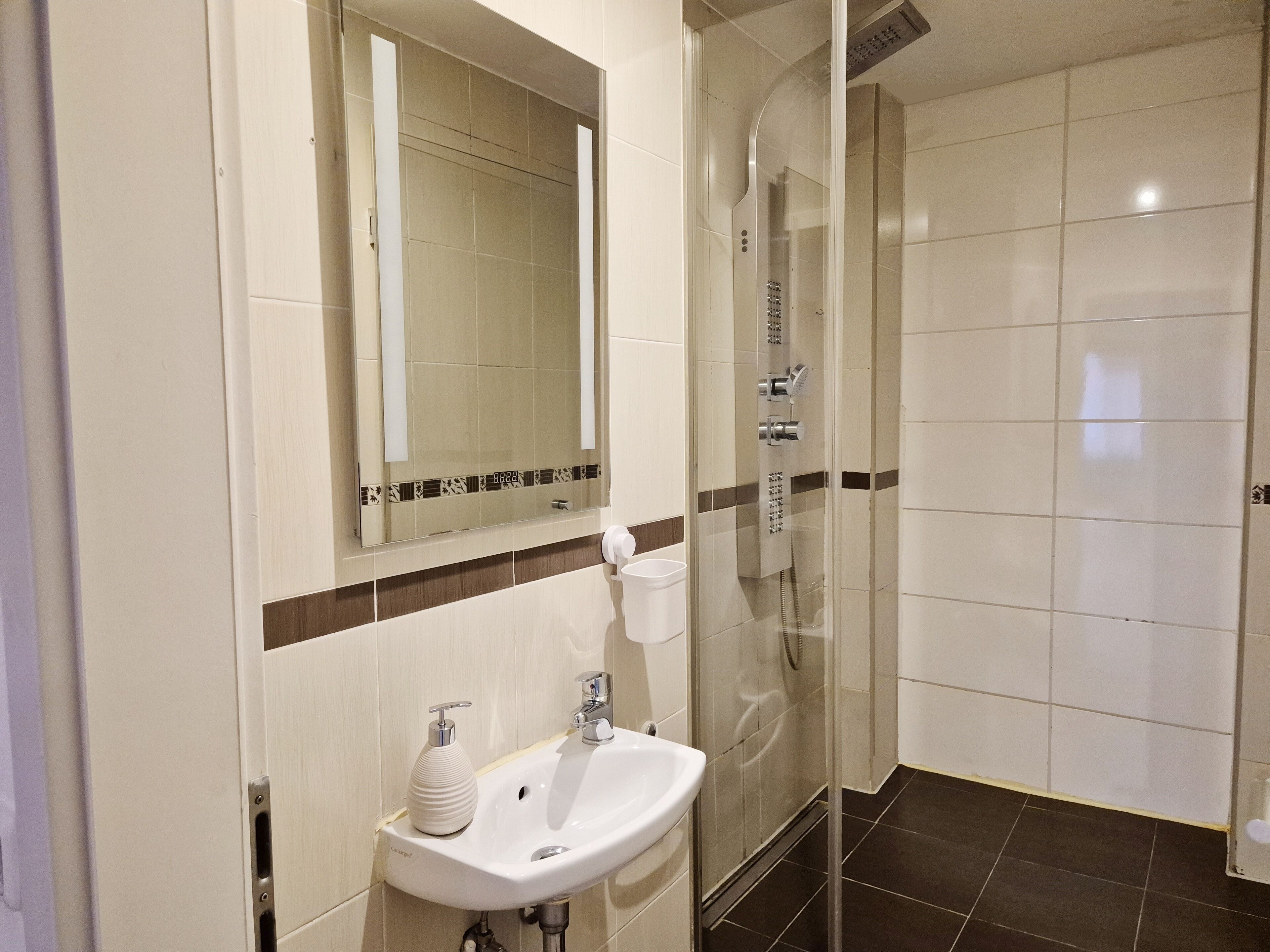 Shower, hair dryer, towels, soap