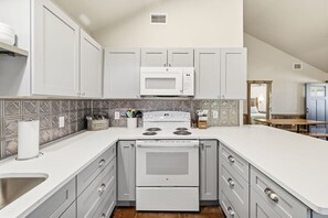 Fridge, microwave, oven, stovetop - New Cabin - Riverfront Resort- Hunt, TX (Ingram)