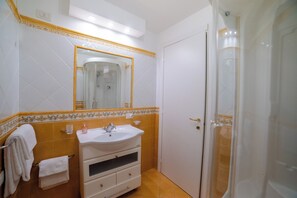 Shower, hair dryer, soap, shampoo