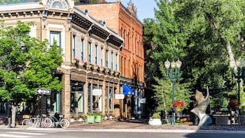 A street with historic buildings, a bicycle, and a street lamp.