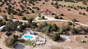 An aerial view of a property with a house, swimming pool, and a basketball court. - Hacienda Roja - The Sage #6 at Wind Walker Homestead (Spring City)