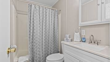 Combined shower/bathtub, hair dryer, towels, soap