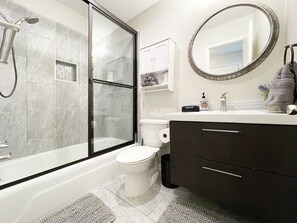 Combined shower/bathtub, hair dryer, towels, soap