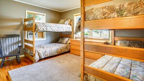 A bunk bed room with a window, a rocking chair, and a small desk. - Welcoming Biggers Home - Great Duck Hunting! (Biggers)