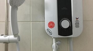 A water heater with a digital display and a red compliance sticker. - Hoang Nam Hotel by Zuzu (Ho Chi Minh Municipality)