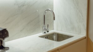 A kitchen with a stainless steel sink and a modern faucet. - Legacy Oporto Design Apartment A by Vacationy (Porto)