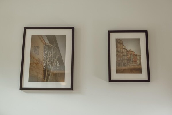 Two framed pictures on a wall.