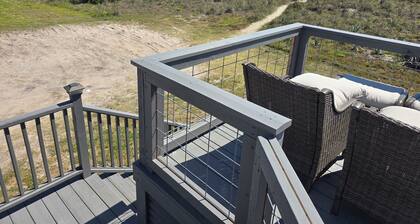 Beach front cottage - don't let the outside fool you - check out the photos!