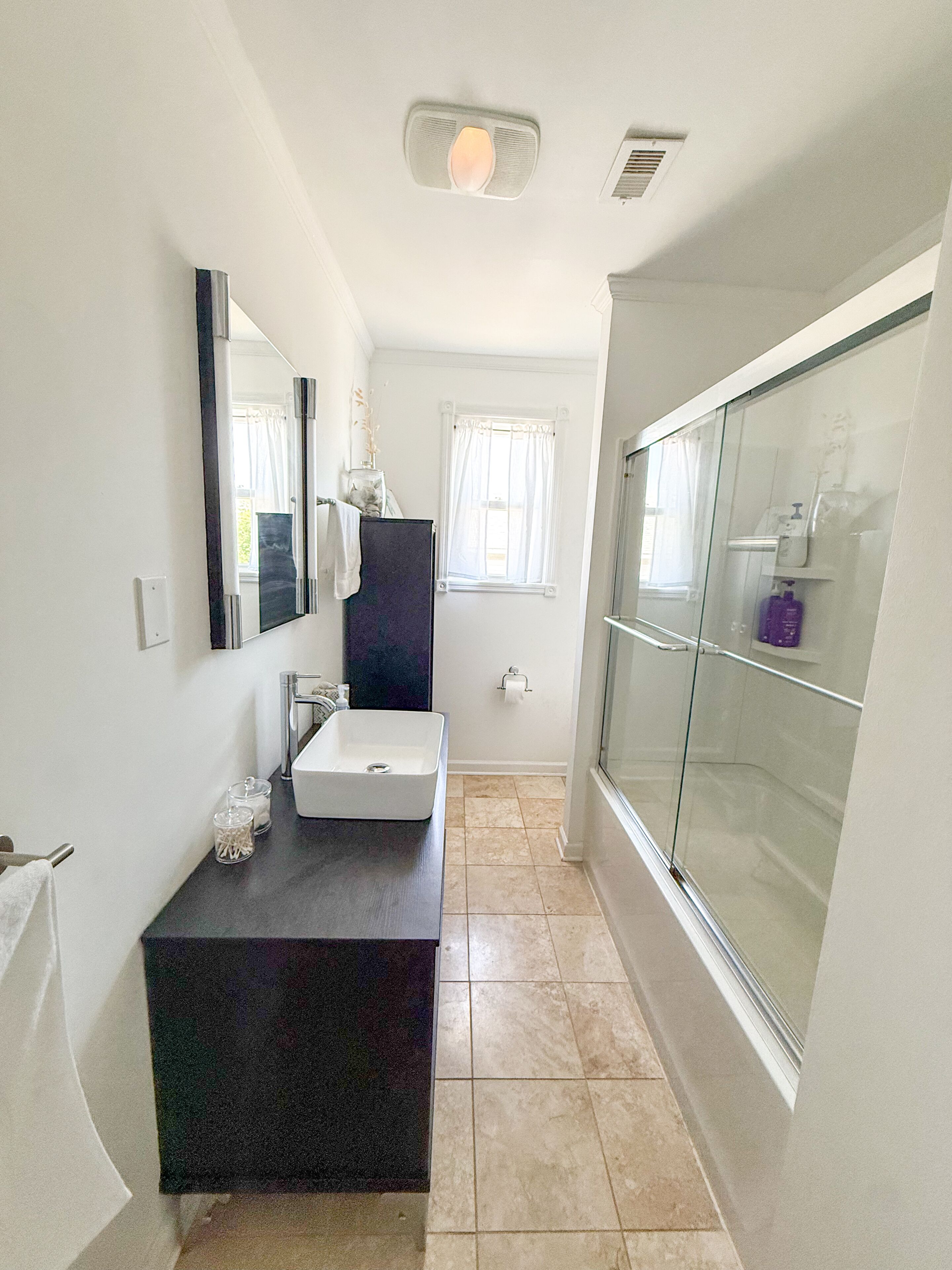 Combined shower/tub, hair dryer, towels, toilet paper