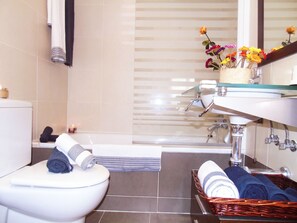 Bathtub, hair dryer, towels