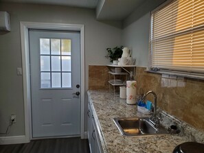 Fridge, microwave, stovetop, coffee/tea maker