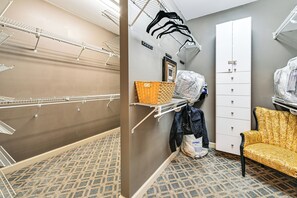 A laundry room with multiple drying racks, a storage closet, and a patterned floor. - Lake Norman Cove Home w/ Golf Sim & Kayaks (Sherrills Ford)