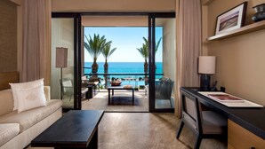 A hotel room with a balcony, a sofa, a desk, and a view of the ocean. - Casa Maat At JW Marriott Los Cabos Beach Resort & Spa (San José del Cabo)