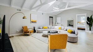 A spacious living room with a high ceiling, a large window, and a modern design. - modERn Luxury Home🌇🎆🌉Limited time offer! (Walnut Creek)