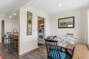 A modern kitchen with wooden cabinets, a microwave, and an oven. - Amazing Lake View Walk-In Condo, Newly Renovated Spacious Near Silver Dollar City with Free Tickets (Branson)