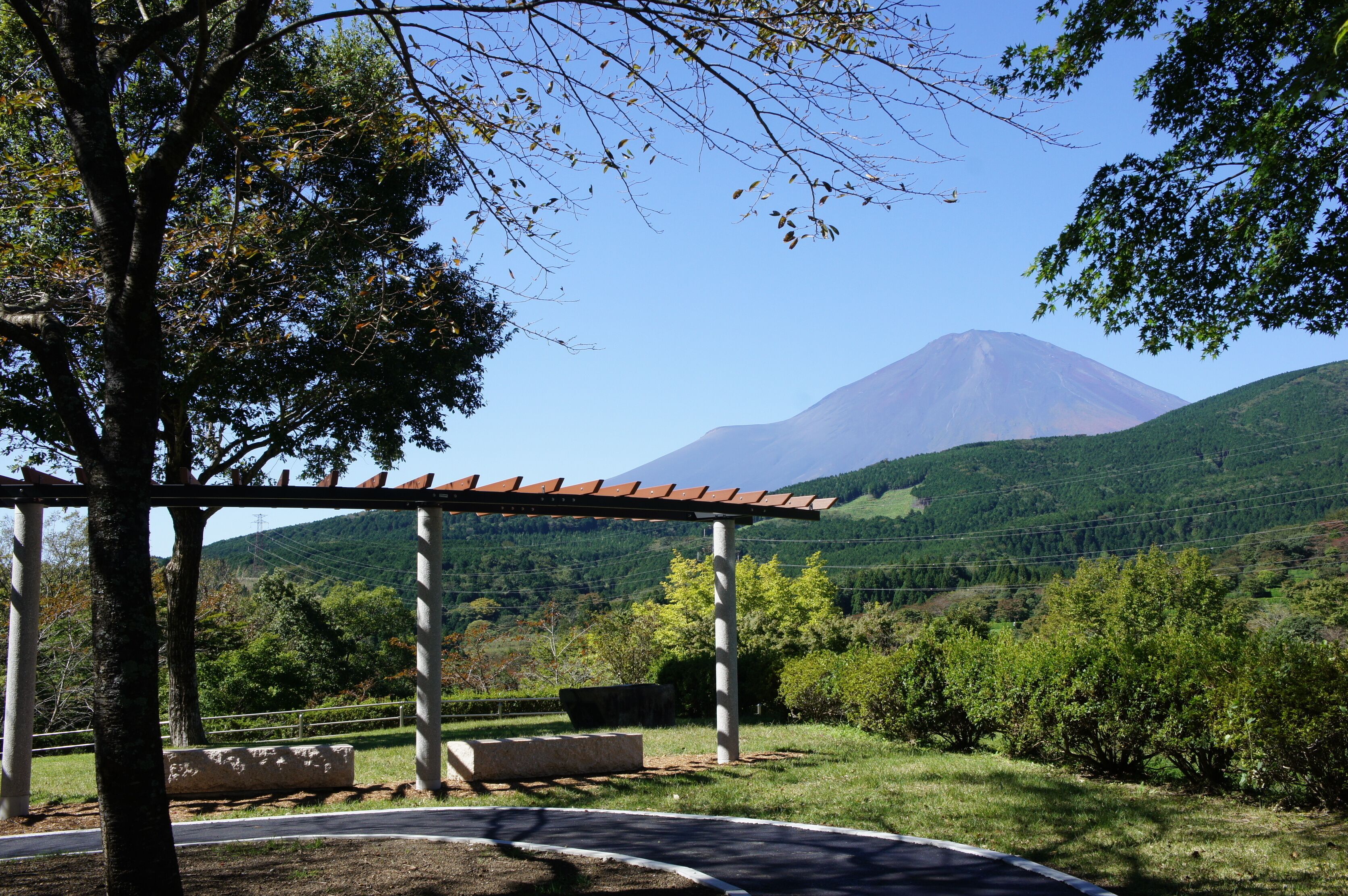 A gazebo with a view of a mountain.