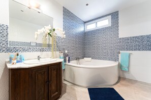 Bathtub, hair dryer, towels