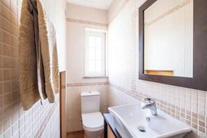 Bathtub, hair dryer, towels