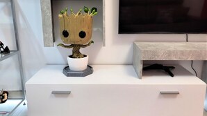 A white dresser with a Groot figurine on top. - Marvel Apartment with Pool near Playa Vera (Vera Playa)