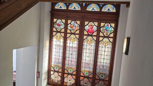 A stained glass window with intricate designs and a wooden frame. - T2 Apartment in Castle, 4 people, pool, pets allowed (Jausiers)