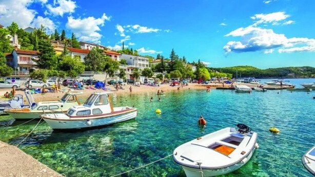 A coastal town with clear waters, boats, and buildings along the shore. - Inviting apartment in Jadranovo with balcony/terrace (Jadranovo)