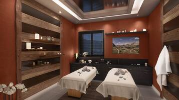Relax in a serene spa room with two massage tables, a wooden shelving unit, and a beautiful landscape painting.