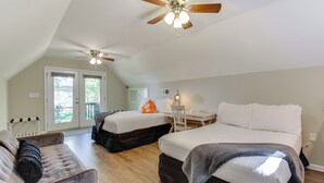 A bedroom with two beds, a desk, a chair, and a ceiling fan. - Clemson Game Day Cottage w/ Fire Pit (Central)