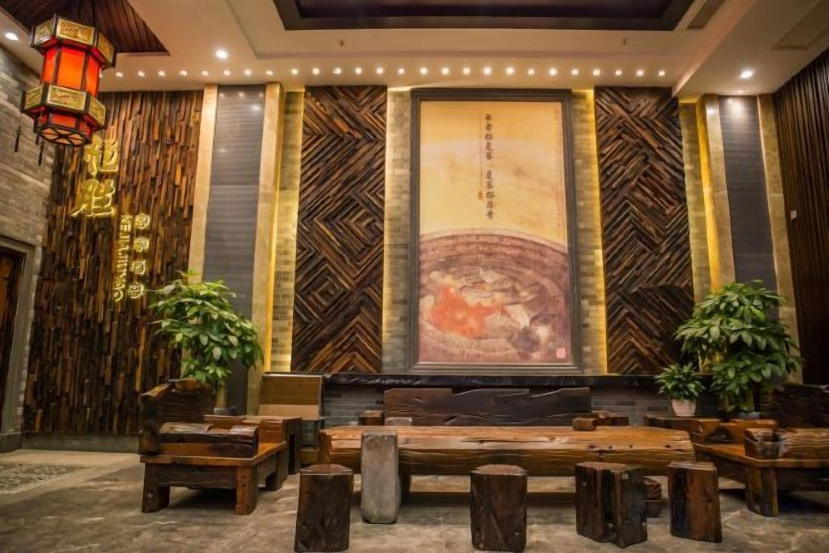 A lobby with a stage, seating area, and decorative elements.