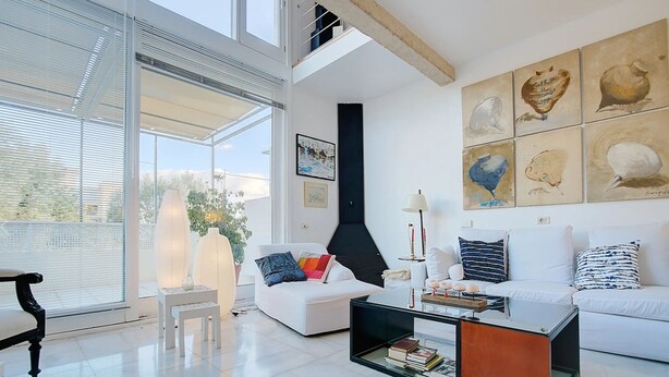 A modern living room with white sofas, a glass coffee table, and artwork on the walls. - Villa Bonanova Style (Palma)