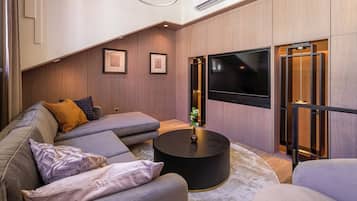 Departamento Premium | Área de sala de estar | Smart TV de 50 pulgadas con canales vía satélite y televisión
