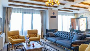 Luxury Duplex | Living area | 60-inch LED TV with satellite channels, fireplace, video-game console