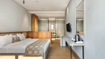 Triple Deluxe With Balcony | In-room safe, desk, laptop workspace, blackout curtains