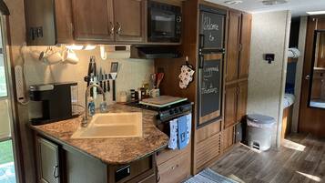 Fridge, microwave, stovetop, coffee/tea maker