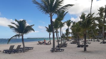 On the beach, sun-loungers, beach towels