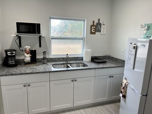 Fridge, microwave, coffee/tea maker, toaster