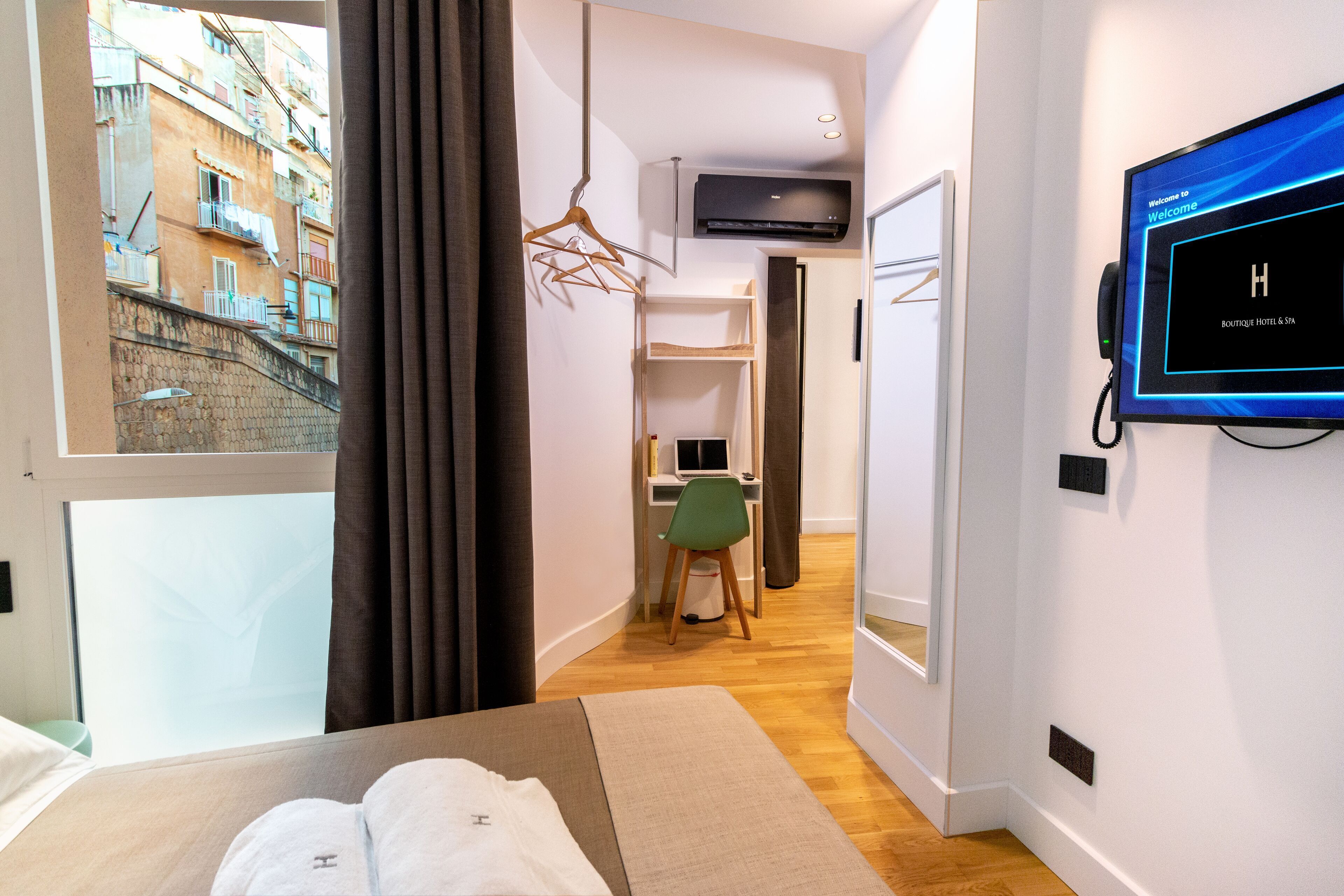 Premium bedding, down comforters, in-room safe, desk