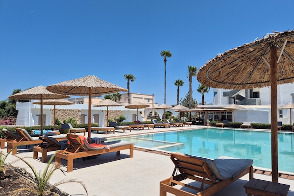 2 outdoor pools, open 10:00 AM to 6:00 PM, pool umbrellas, sun loungers