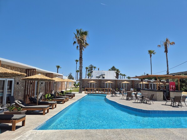 2 outdoor pools, open 10:00 AM to 6:00 PM, pool umbrellas, pool loungers