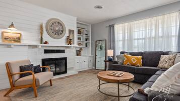 Smart TV, fireplace, books, printers