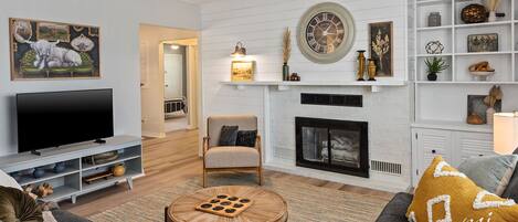 Smart TV, fireplace, books, printers