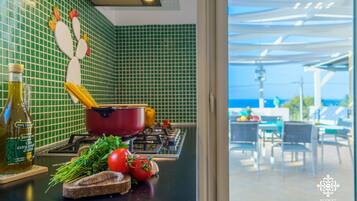 Fridge, coffee/tea maker, high chair, dining tables