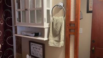 Combined shower/tub, hair dryer, towels, soap