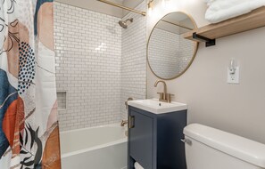 Combined shower/tub, hair dryer, towels, soap