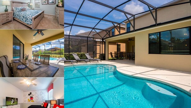 A bedroom with a bed, a TV, and a Mickey Mouse wall mural. - Providence Golf & Country Club Pool Home in Gated & Guarded Community (Davenport)