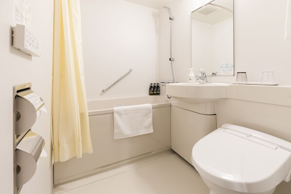 A modern bathroom with a toilet, sink, and shower. - Sotetsu Fresa Inn Sapporo-Susukino (Sapporo)
