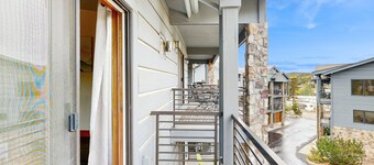 Luxe downtown condo with mountain views, balcony, grill, fireplace, & W/D