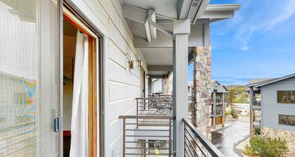 Luxe downtown condo with mountain views, balcony, grill, fireplace, & W/D
