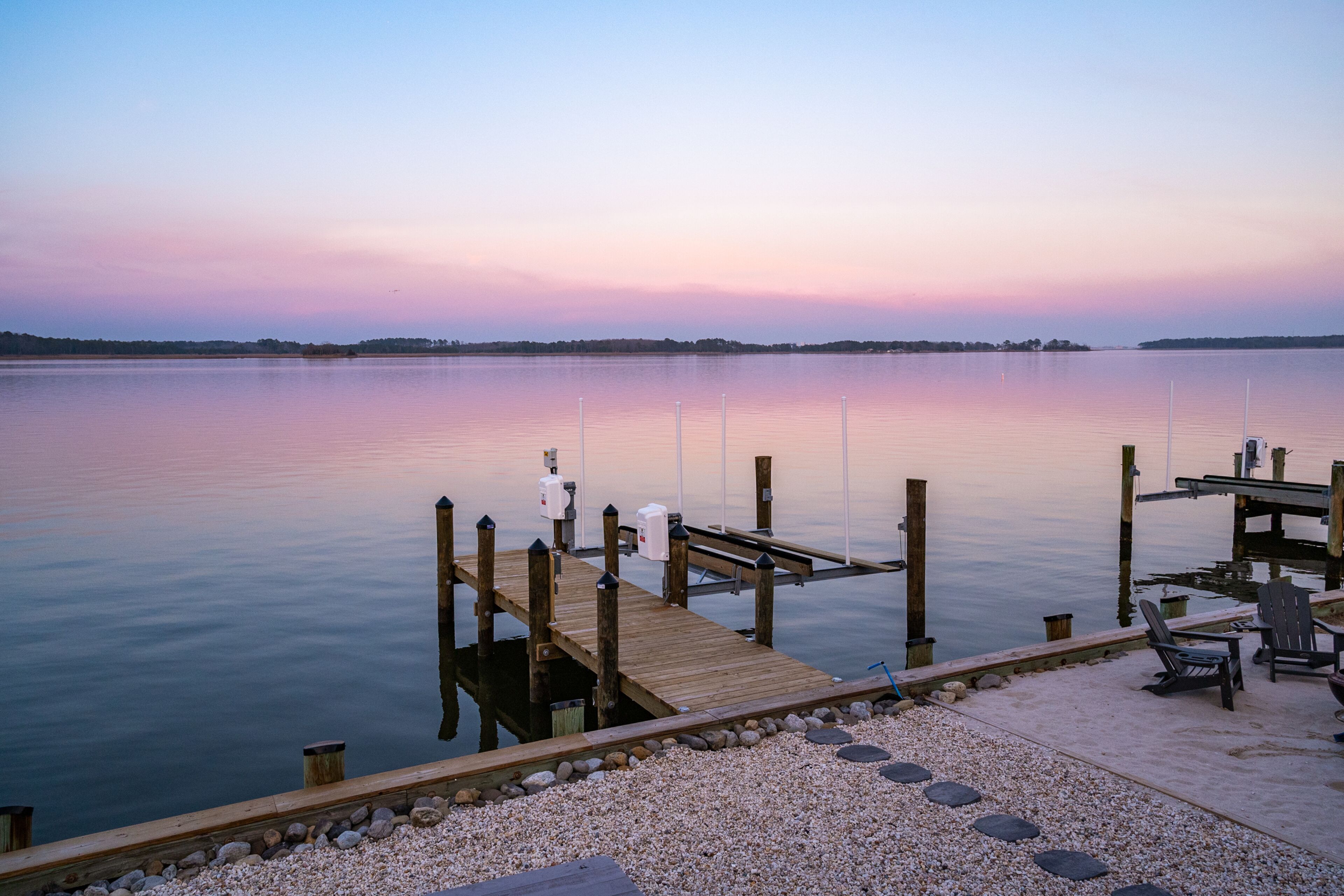 Beautifully renovated bayfront home with deck, game room, fireplace & EV charger