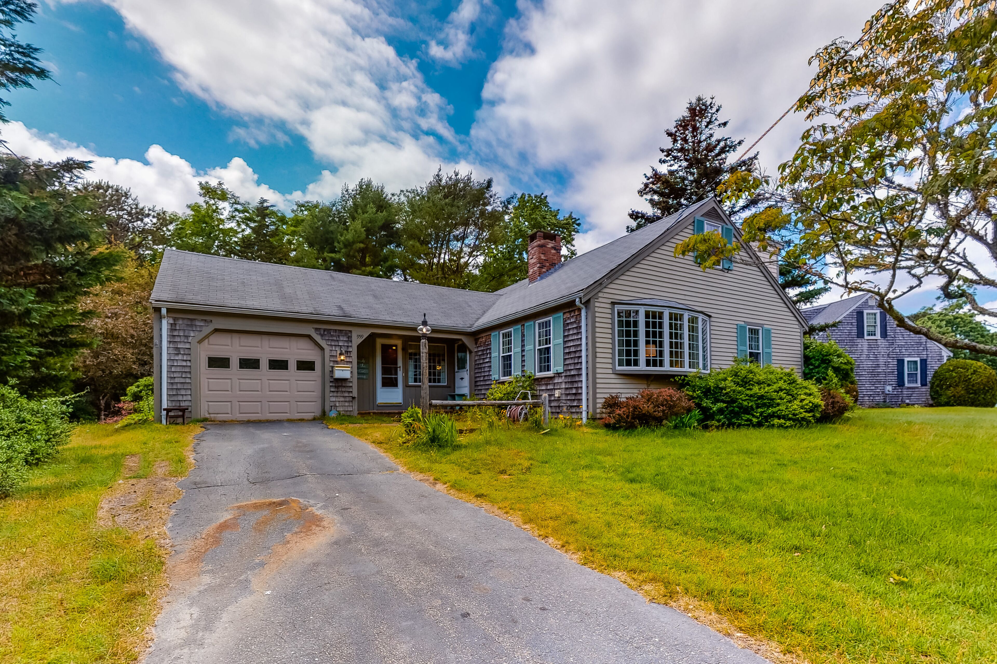 Charming home in central location with grill, fire pit, four-season room, & WiFi