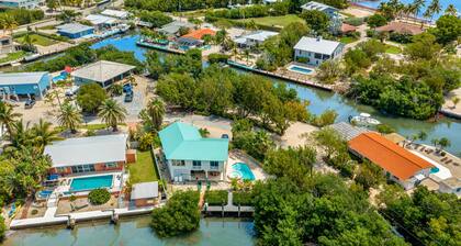 Waterfront hideaway with dock, pool & inviting patio - walk to Sombrero Beach